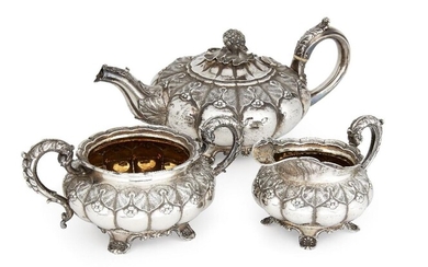 A George IV three piece silver tea set, London, c.1824 and 1825, Rebecca Emes & Edward Barnard, the melon-shaped teapot with chased repousse leaf and flowerhead decoration to lobed body, the hinged lid with textured bud finial, each piece raised on...