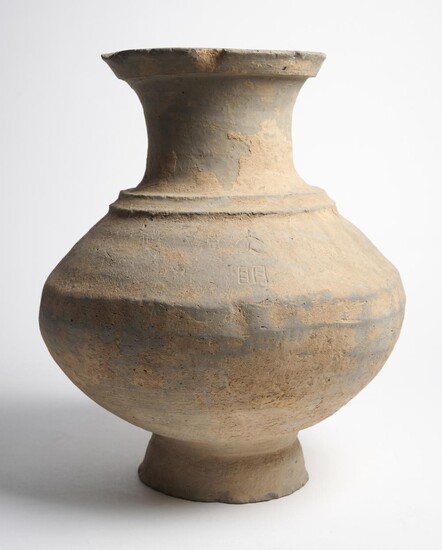 A LARGE CHINESE INSCRIBED GREY-WARE HU-FORM VESSEL HAN DYNASTY (202 B.C. - 220 A.D.)