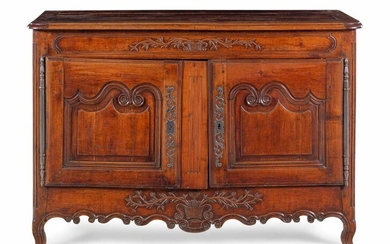 A Louis XV Provincial Carved Walnut Cabinet