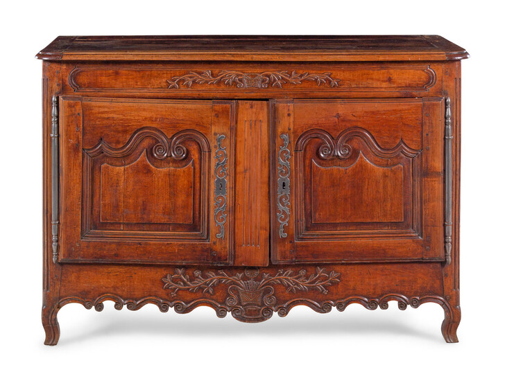 A Louis XV Provincial Carved Walnut Cabinet
