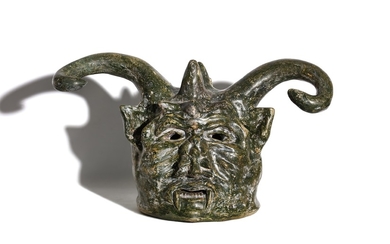 A MYSTERIOUS AND LARGE 19TH CENTURY PAINTED TERRACOTTA HEAD OF A DEVIL, DATED 1873