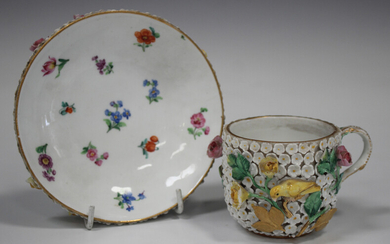 A Meissen porcelain schneeballen cup and saucer, late 19th century, the cup exterior and saucer unde