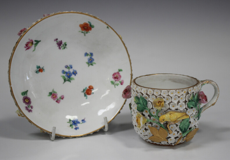 A Meissen porcelain schneeballen cup and saucer, late 19th century, the cup exterior and saucer unde