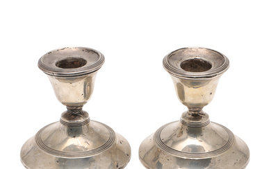 A PAIR OF DRESSING TABLE CANDLESTICKS.