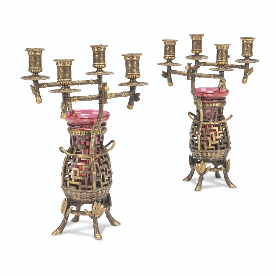 A PAIR OF FRENCH PARCEL-GILT AND PATINATED-BRONZE FOUR-LIGHT CANDLEABRA
