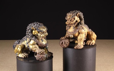 A Pair of 19th Century Gilded Cast Iron Dogs of Fo. The ferocious beasts depicted with tightly curle