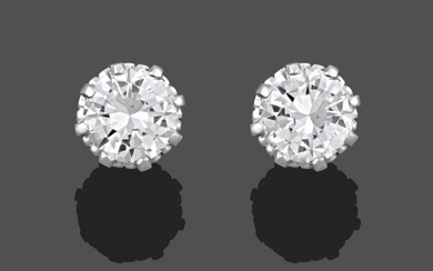 A Pair of Diamond Solitaire Earrings, the round brilliant cut...