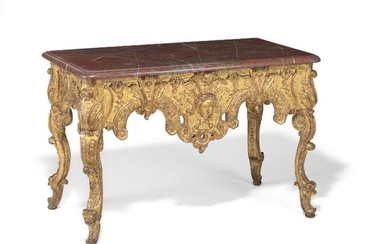 A Régence moulded, carved and giltwood console table. C. 1720. H. 85 cm. L. 132 cm. D. 72.5 cm.