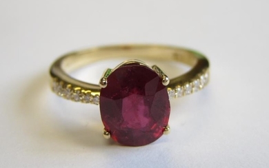 A Ruby and Diamond Ring claw-set oval-cut ruby, 2.29cts,...