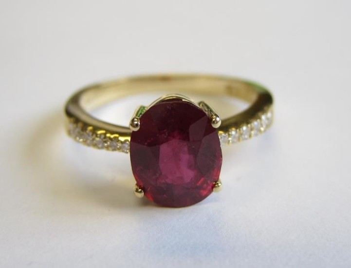 A Ruby and Diamond Ring claw-set oval-cut ruby, 2.29cts,...