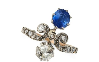 A SAPPHIRE AND DIAMOND TIARA RING in 18ct yellow gold, set with a round cut sapphire of approxima...