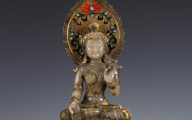 A SILVER DECORATED JADE BODHISATTVA WITH GILT BRONZE