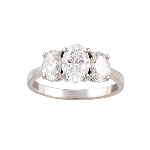 A THREE STONE DIAMOND RING, the oval brilliant cut diamonds ...