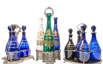A TRIO OF BRISTOL BLUE DECANTERS AND A MATCHED QUARTET OF BR...