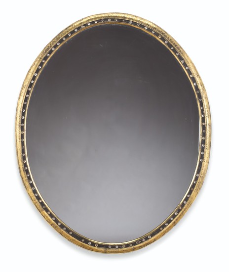 A VICTORIAN GILTWOOD, PARCEL-EBONIZED AND JEWELED MIRROR, POSSIBLY IRISH, SECOND HALF 19TH CENTURY