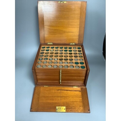 A coin and medal collection in a Victorian mahogany 12 coin ...