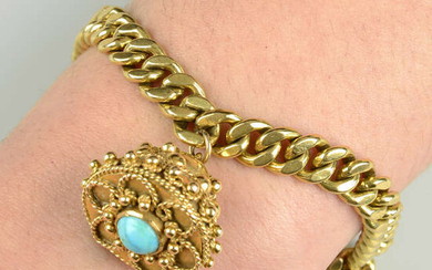 A curb-link bracelet, with turquoise cannetille charm.