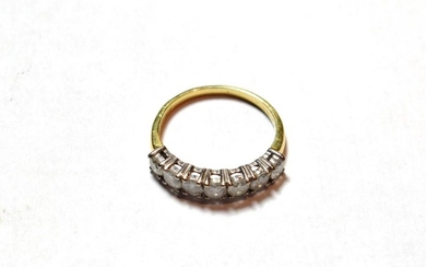 A diamond seven stone ring, finger size M