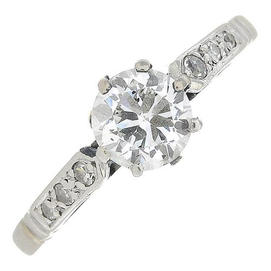 A diamond single-stone ring.Stamped