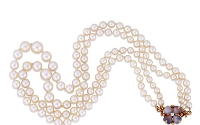 A graduated cultured pearl necklace comprised of a double...