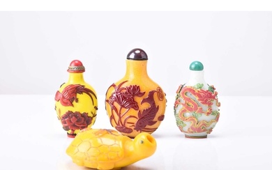 A group of four Chinese overlay glass snuff bottles, 19th/20...
