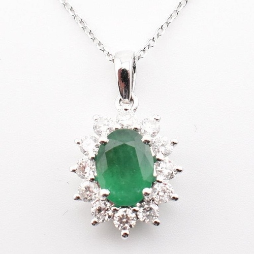 A hallmarked 18ct white gold and diamond pendant necklace. T...