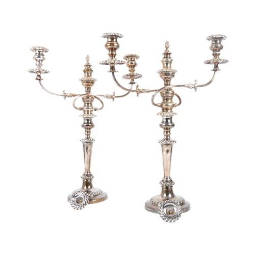 A hallmarked silver pair of George III candelabra candlestic...