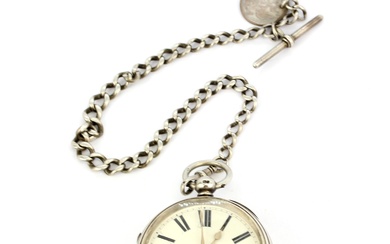 A heavy hallmarked silver cased key wind pocketwatch on a hallmarked silver Albert chain with key. Some damage to glass face.