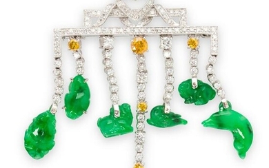 A jade, diamond and eighteen karat white gold brooch