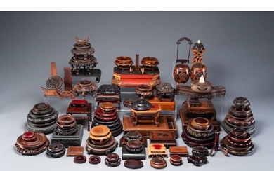 A large collection of 76 varied Chinese wooden stands and co...