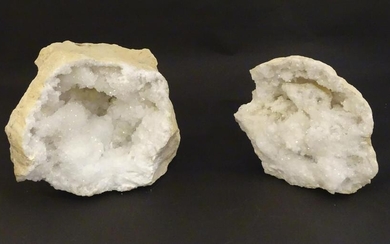 A large split quartz crystal geode in two sections.