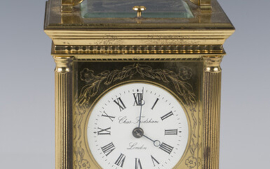 A late 20th century lacquered brass cased carriage clock with eight day jewelled movement striking h