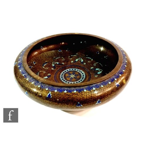 A late Qing Dynasty Chinese cloisonne bowl with folded round...