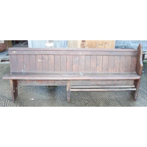 A late Victorian stained pine single-ended pew, 86" long