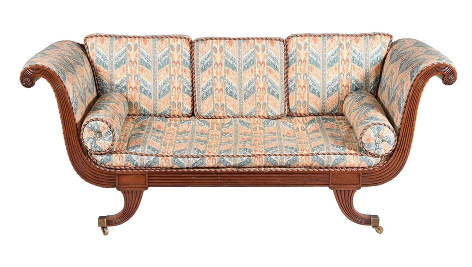 A mahogany and upholstered sofa in Regency taste