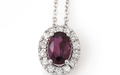 A necklace with a pendant set with an oval-cut ruby weighin app....