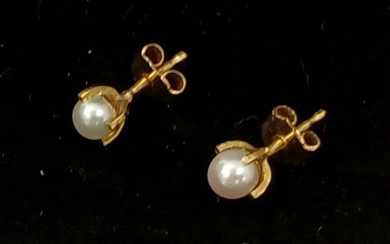 A pair of 14k gold and pearl earrings. 6mm...