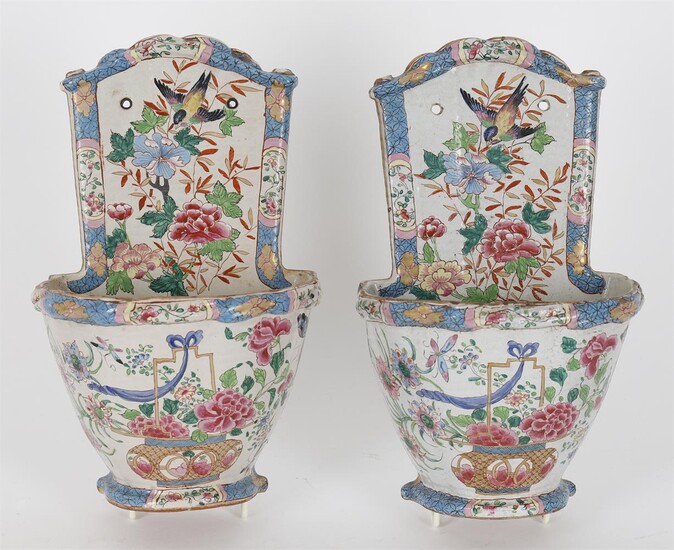 A pair of 19th century French faience wall pockets