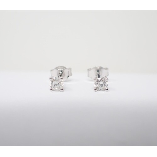 A pair of Diamond Ear Studs each claw-set brilliant-cut ston...
