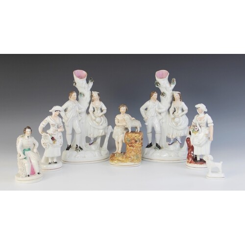 A pair of Staffordshire flat back figural groups, each desig...