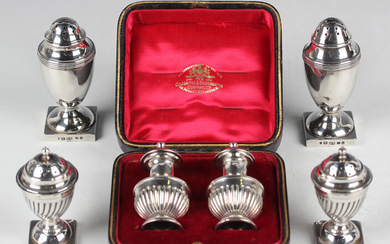 A pair of Victorian silver pepper casters of urn form, Birmingham 1885 by George Unite, height 7.9cm