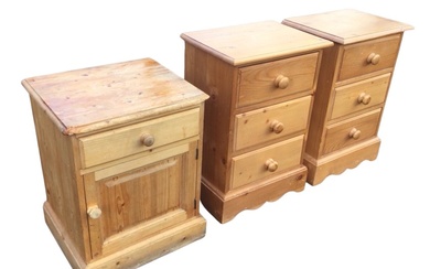 A pair of bedside chests with three moulded knobbed drawers,...