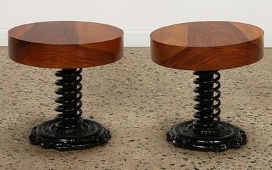 A pair of circular end tables having spring form industrial bases. Ht: 14" Wd: 14.25"