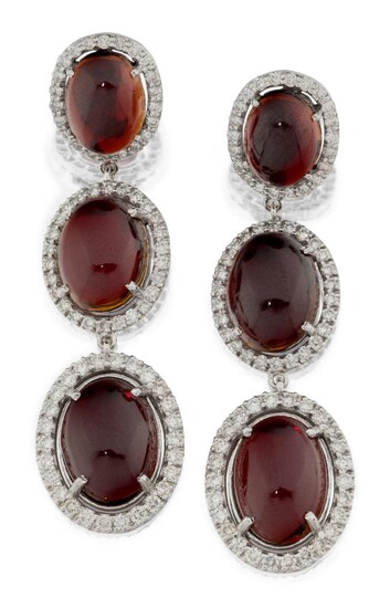 A pair of diamond and garnet drop earrings, each with three graduating oval cabochon garnets within a pave diamond frame, approx. length 5.7cm