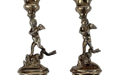 A pair of early 19th century Italian figural candlesticks with...