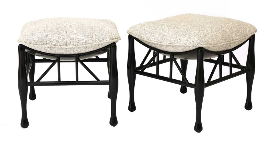 A pair of ebonised Thebes-style stools