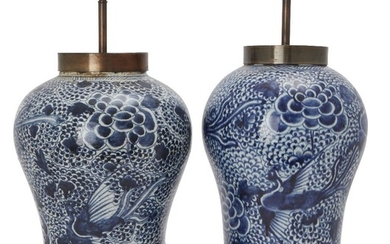 A pair of large Chinese blue and white 'peony and phoenix' jars, 18th century, painted with peonies and phoenixes on a 'fish roe' ground, 35cm high, now mounted as lampsProvenance: Estate of the late designer Anthony Powell (1935 – 2021).十八世紀...