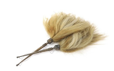 A pair of silver mounted yak's tail fly whisks
