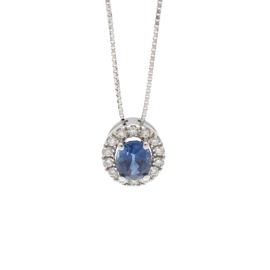 A pendant set with a sapphire weighing app. 0.88 ct. encircled by diamonds, mounted in 18k white gold. Accompanied by chain of 18k white gold. (2)