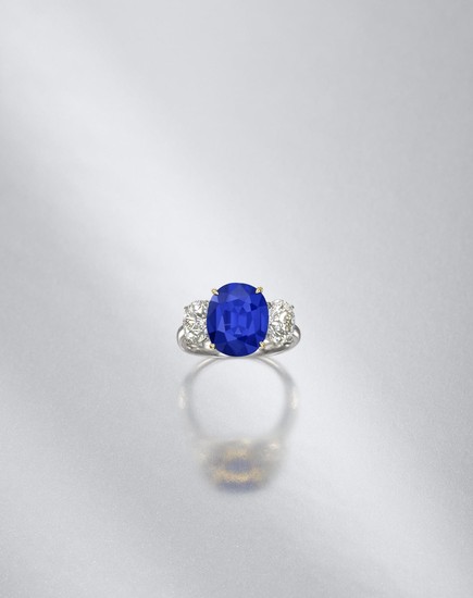 A sapphire and diamond three-stone ring